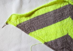 An example of a stockinette stitch shawl (the center part, the border is worked in seed stitch): my Neon Stripes shawl pattern.